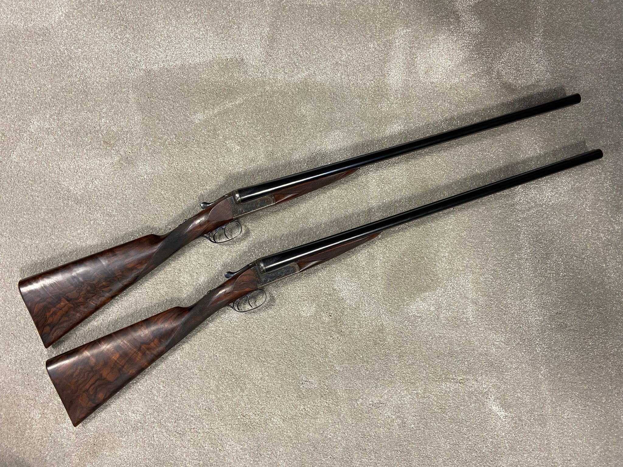 A Pair Of A A Brown Side By Side Shotguns