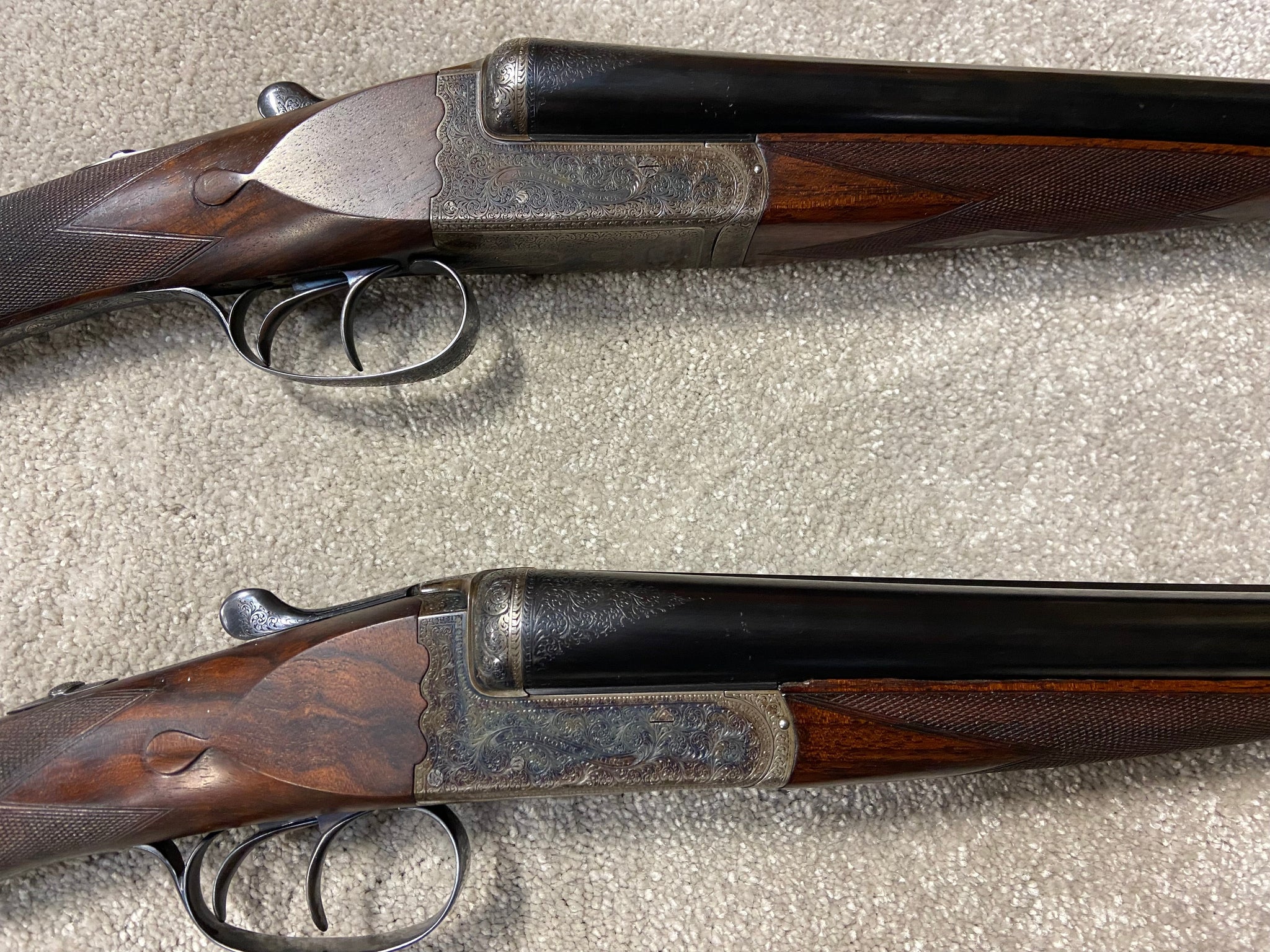 A Pair Of A A Brown Side By Side Shotguns